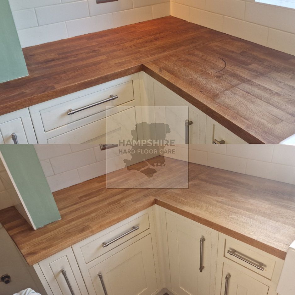 Applying food-safe oil to wooden worktop to enhance grain and protect surface