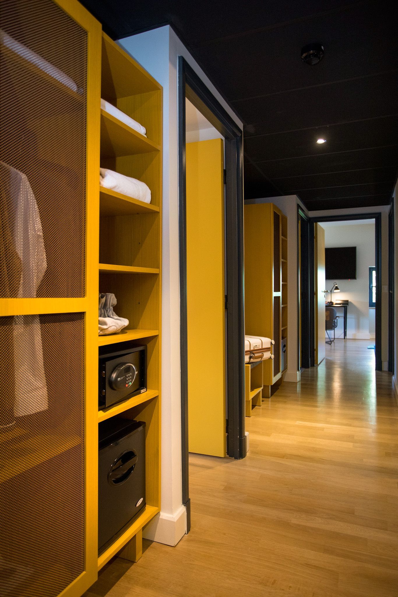 A table with a bowl of strawberries and cranberries on it.