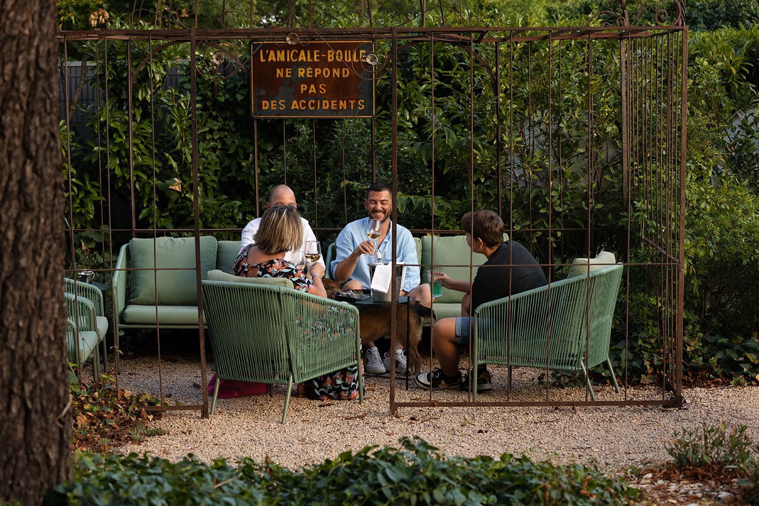 A bathroom with two sinks , a tub and a mirror.
