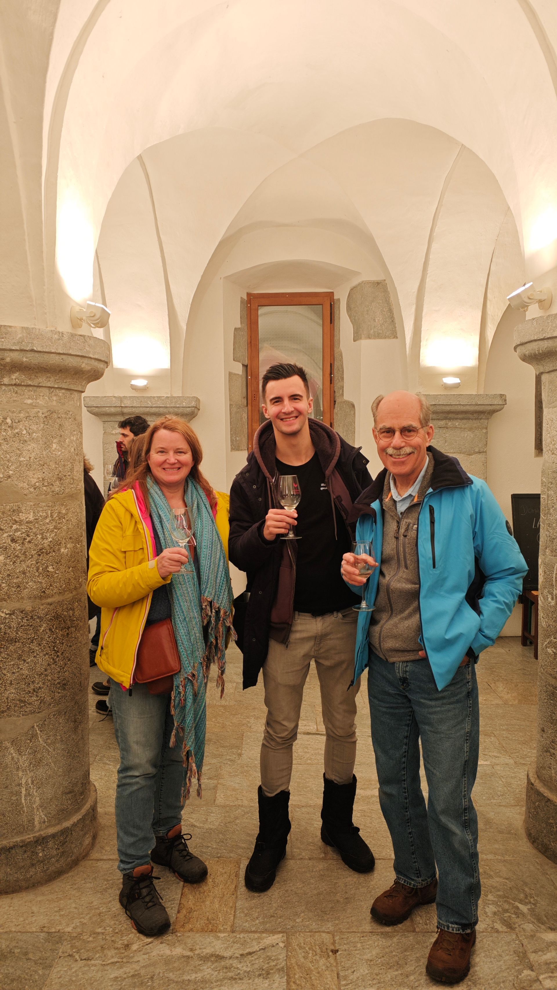 A group of people are standing next to each other in a room.