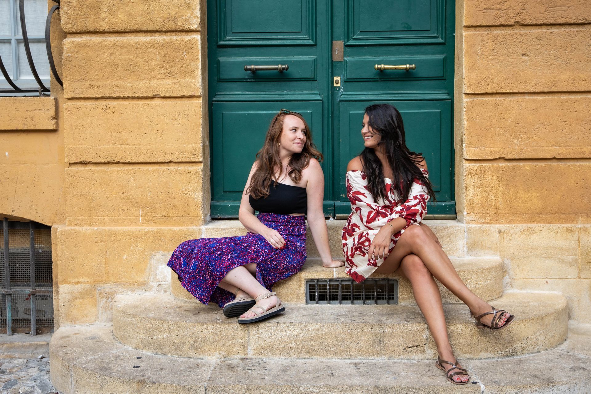 A narrow alleyway between two orange buildings