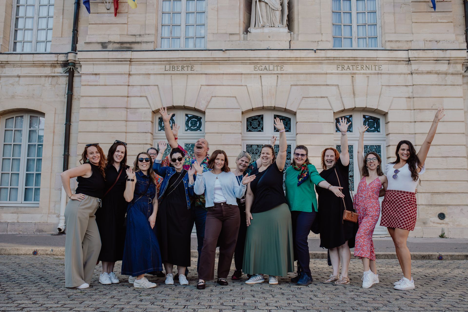 A group of people are sitting around a table in a room.