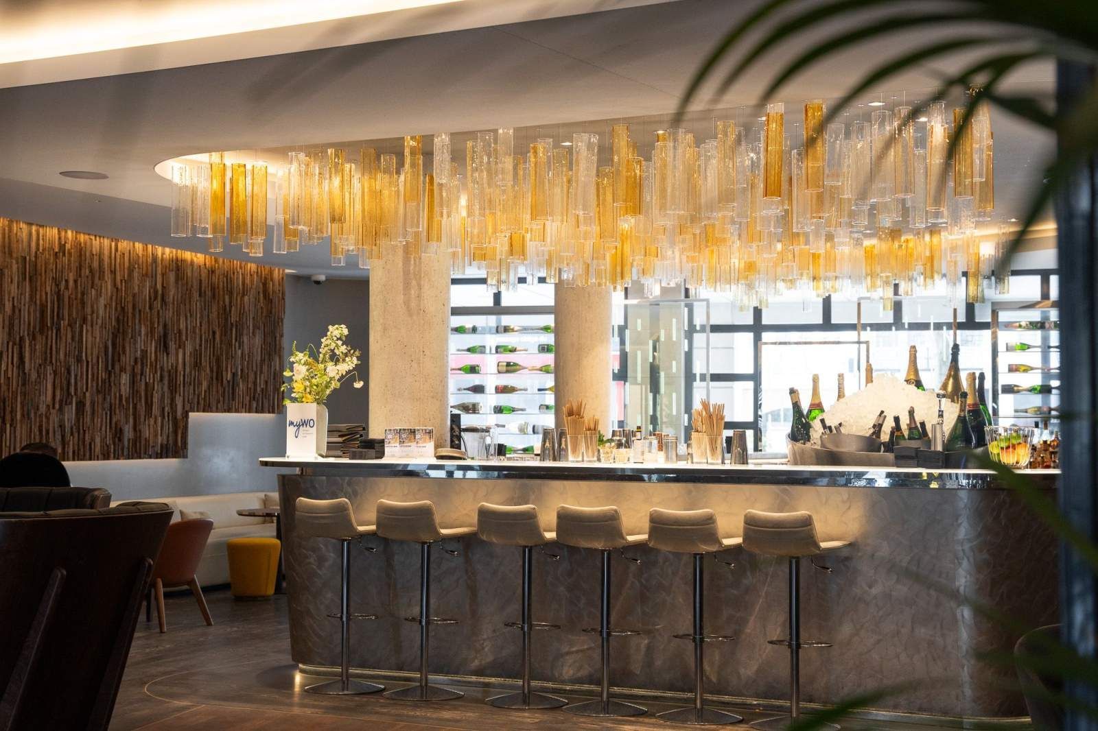 A large building with a bench in front of it.