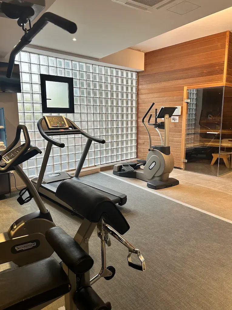 An aerial view of a large castle surrounded by trees.