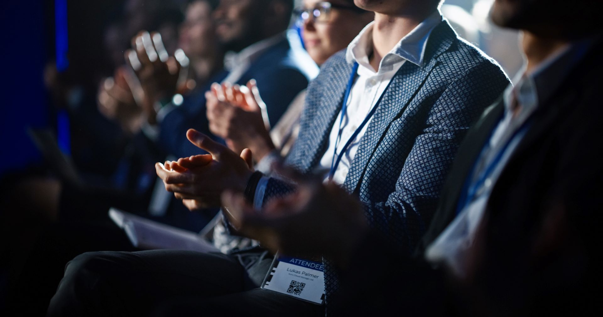 Exhibition attendees clapping