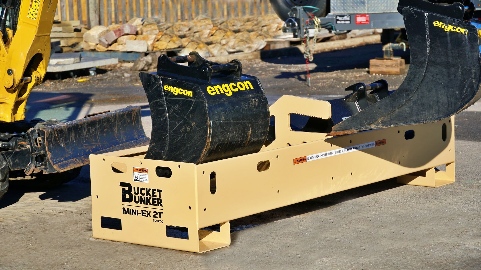 a bucket bunker with a mini-excavator and buckets.