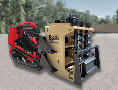A red and black mini-skid steer with a bucket attached to it.