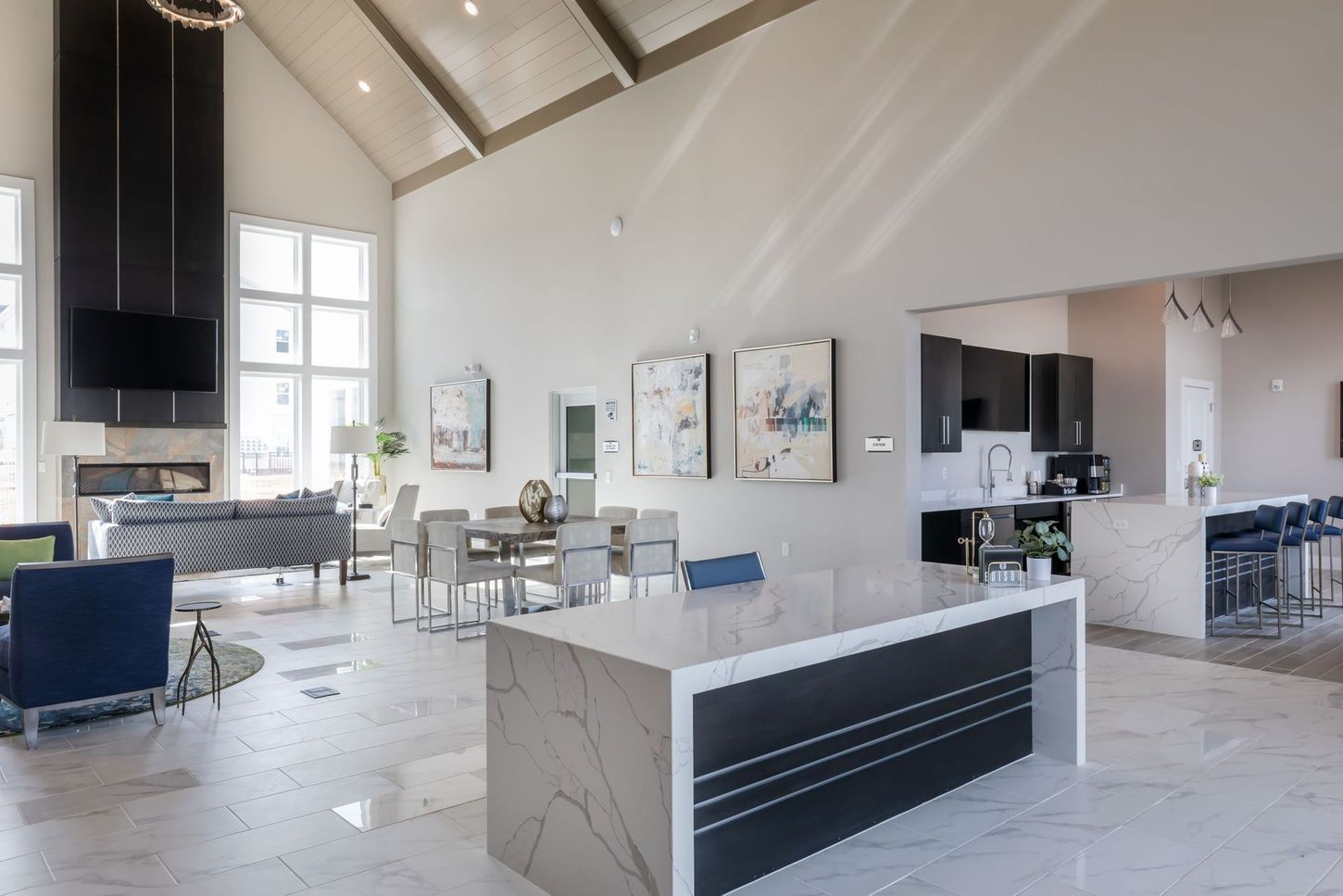A large room with a large island in the middle of it.