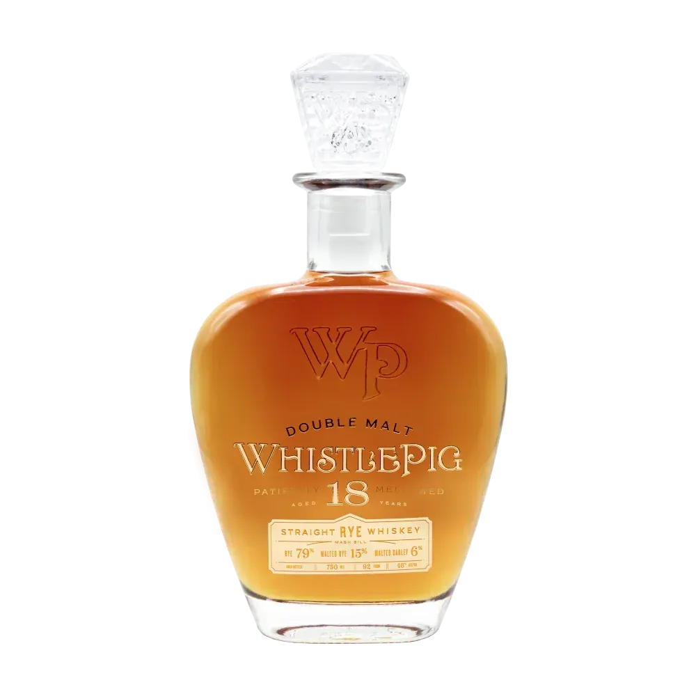 Bottle of WhistlePig 18 Double Malt Rye Whiskey, amber liquid, glass stopper, label visible.