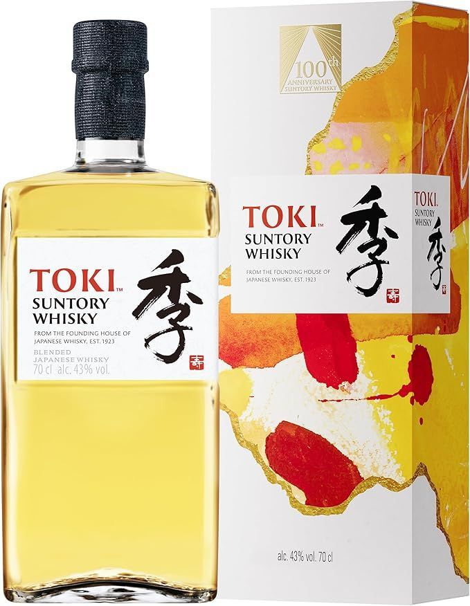 Bottle and box of Suntory Toki Whisky with Japanese characters, white label, yellow and red accents.