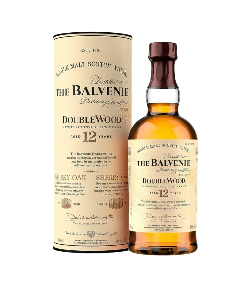 Bottle of The Balvenie Doublewood 12 Year Old Scotch whiskey with its cylindrical tube, amber liquid, cream-colored label.