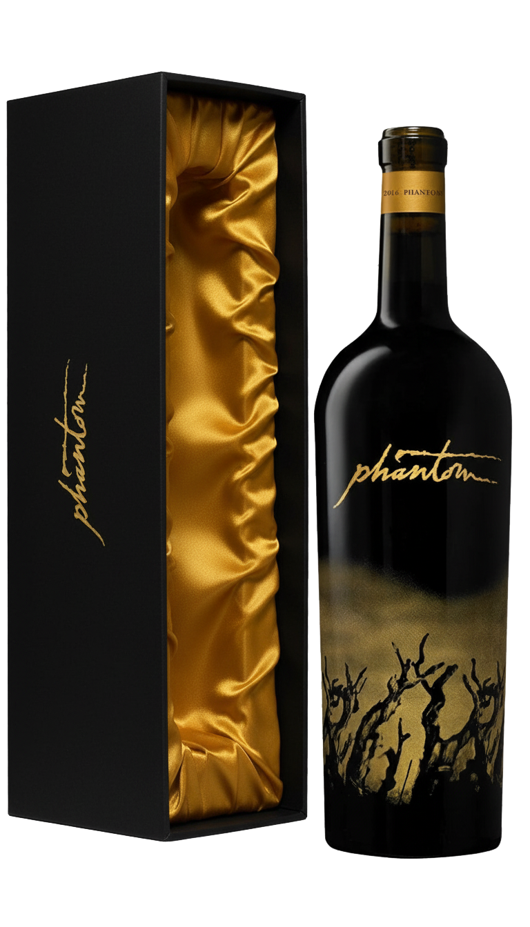 Black wine bottle with gold accents next to a matching box lined with gold fabric; the bottle says 