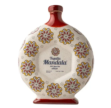 Tequila Mandala bottle with floral design. Creamy white with red and yellow details.