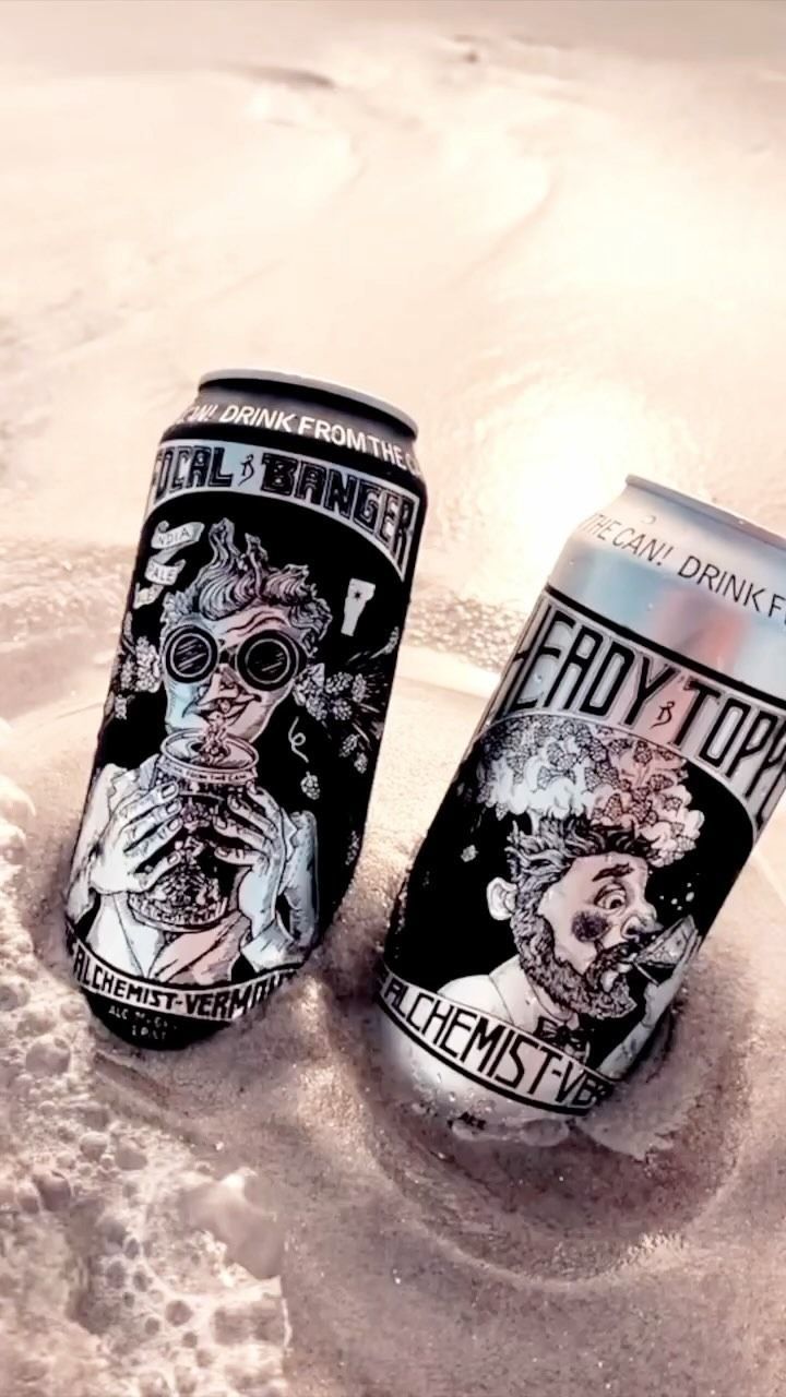 Two beer cans in snow: Alchemist Heady Topper, Badger. Detailed illustrations, silver cans.
