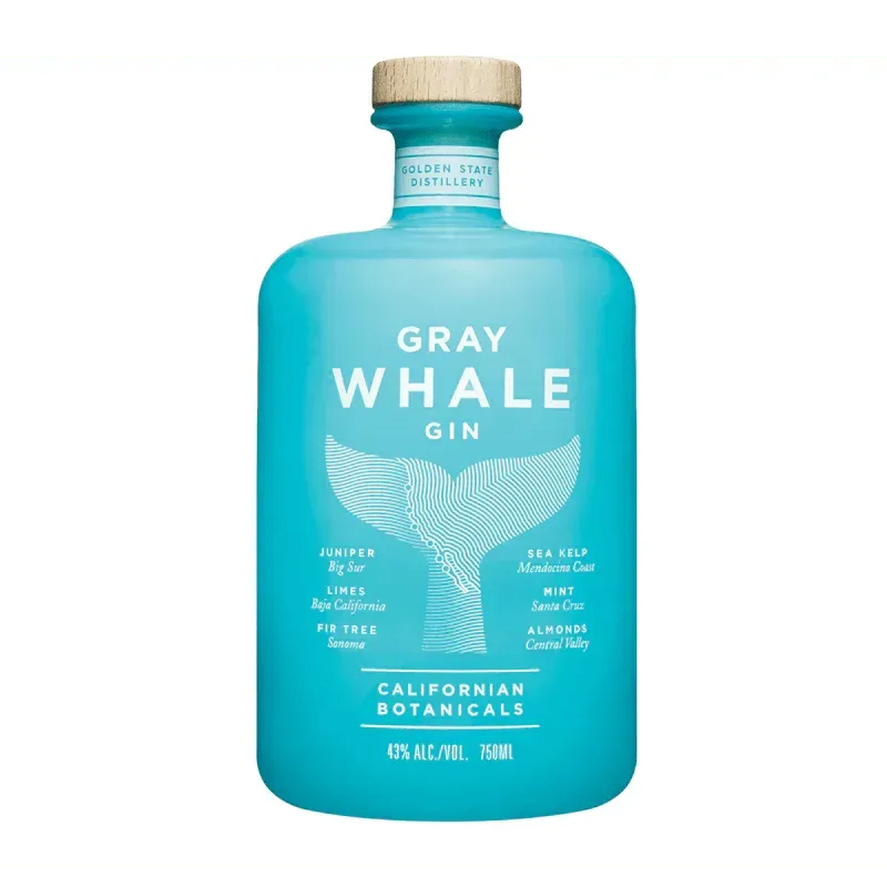 Gray Whale Gin bottle, light blue, with label featuring a whale tail illustration and a wooden cap.