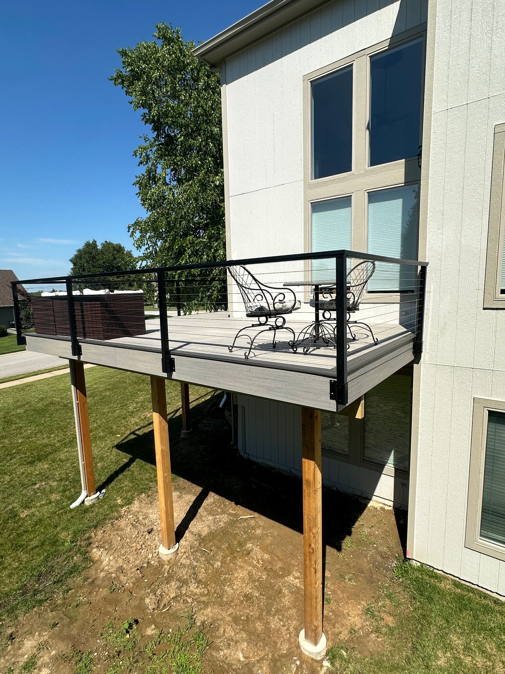 Composite Deck With Black Railing And Furniture