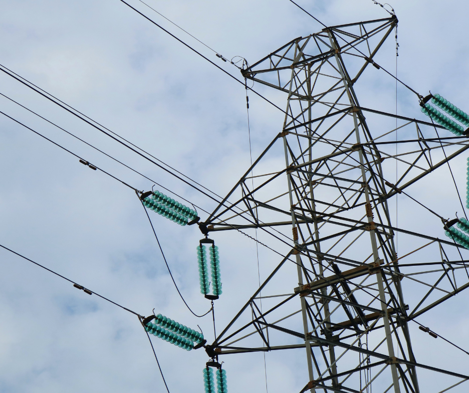 A power tower with a blue sky in the background