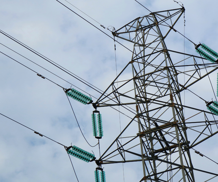 A power tower with a blue sky in the background