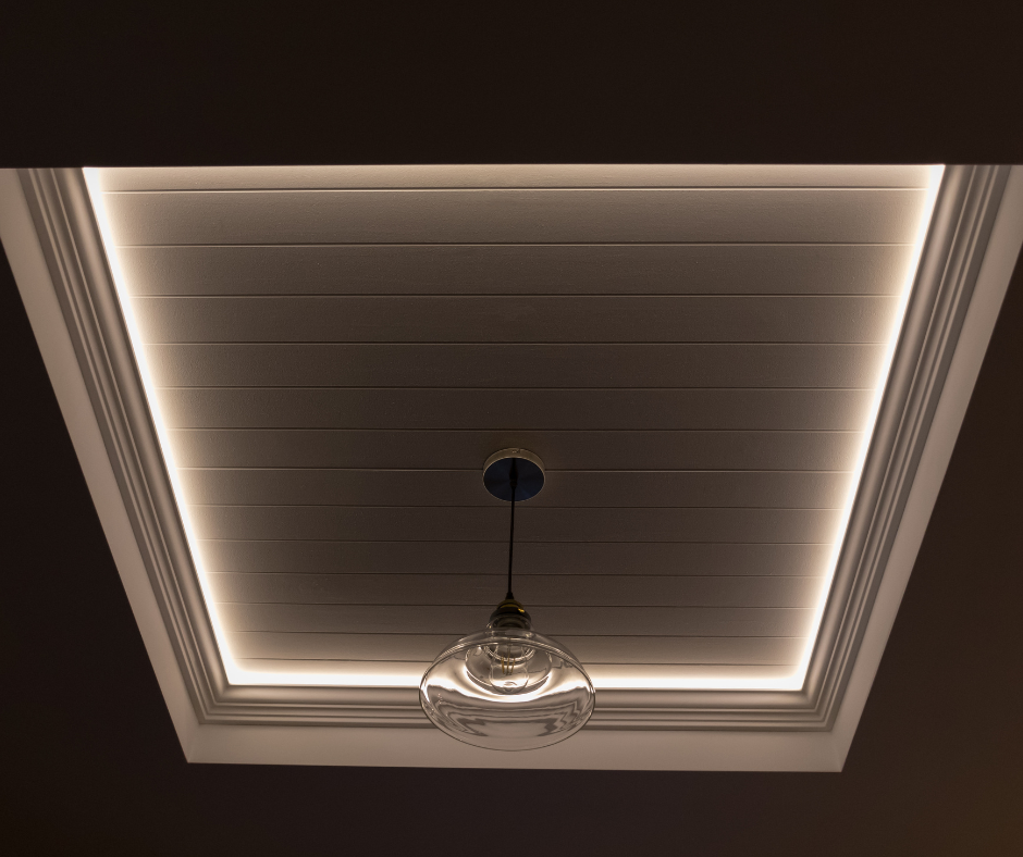 A light fixture is hanging from the ceiling of a room.