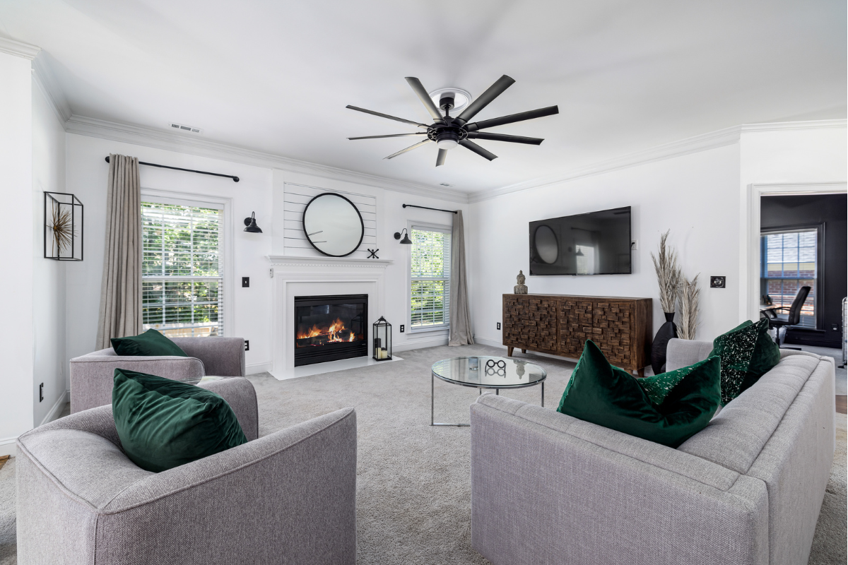 A living room filled with furniture and a fireplace.