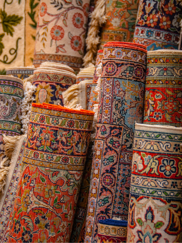 A bunch of different colored squares of carpet on a table