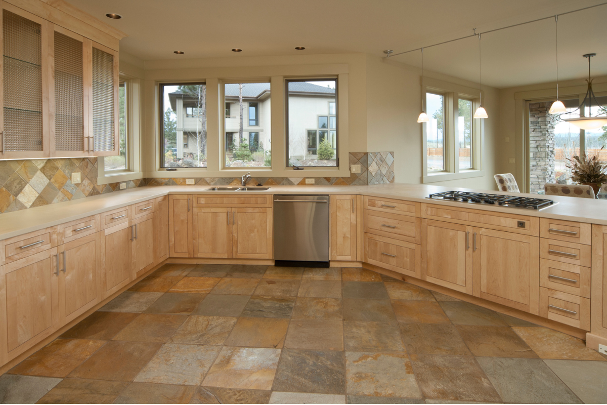 A kitchen with wooden cabinets and stainless steel appliances Menke Inc. Abilene, TX
