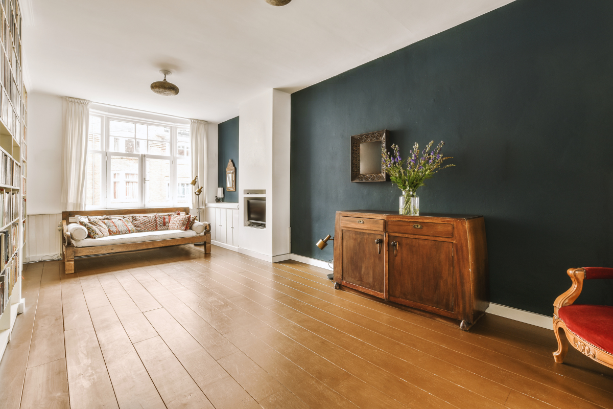 A living room with a couch , dresser , chair and television Menke Inc. Abilene, TX