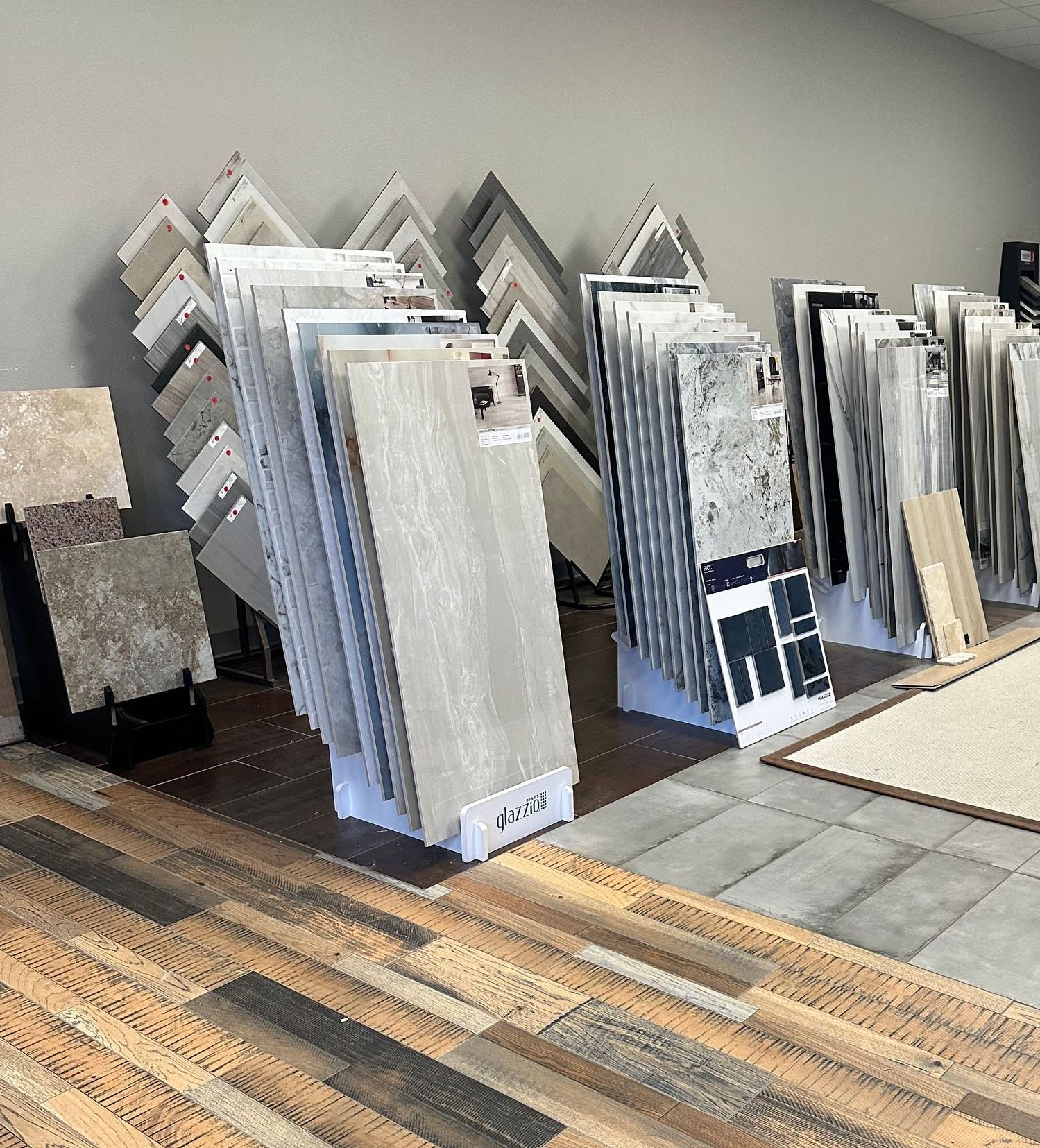 A room filled with lots of tiles and a wooden floor.