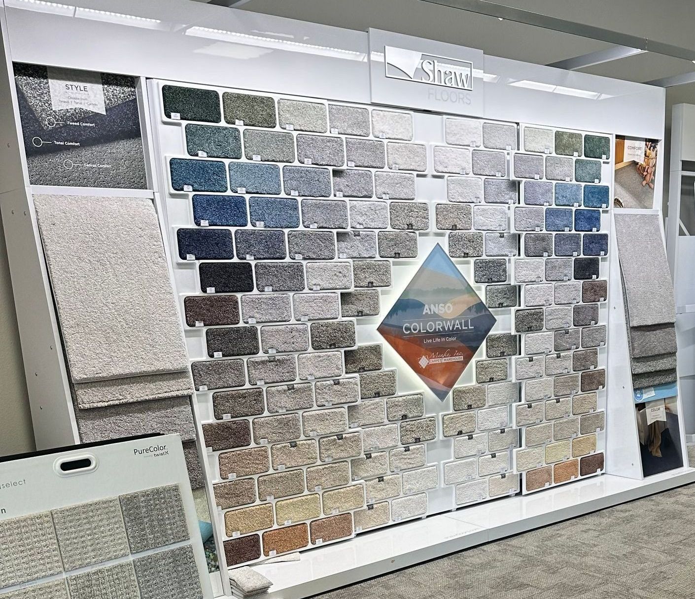There are many different types of carpets on display in a store Menke Inc. Abilene, TX