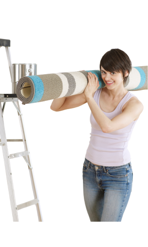 A woman is carrying a rug on her shoulders next to a ladder.