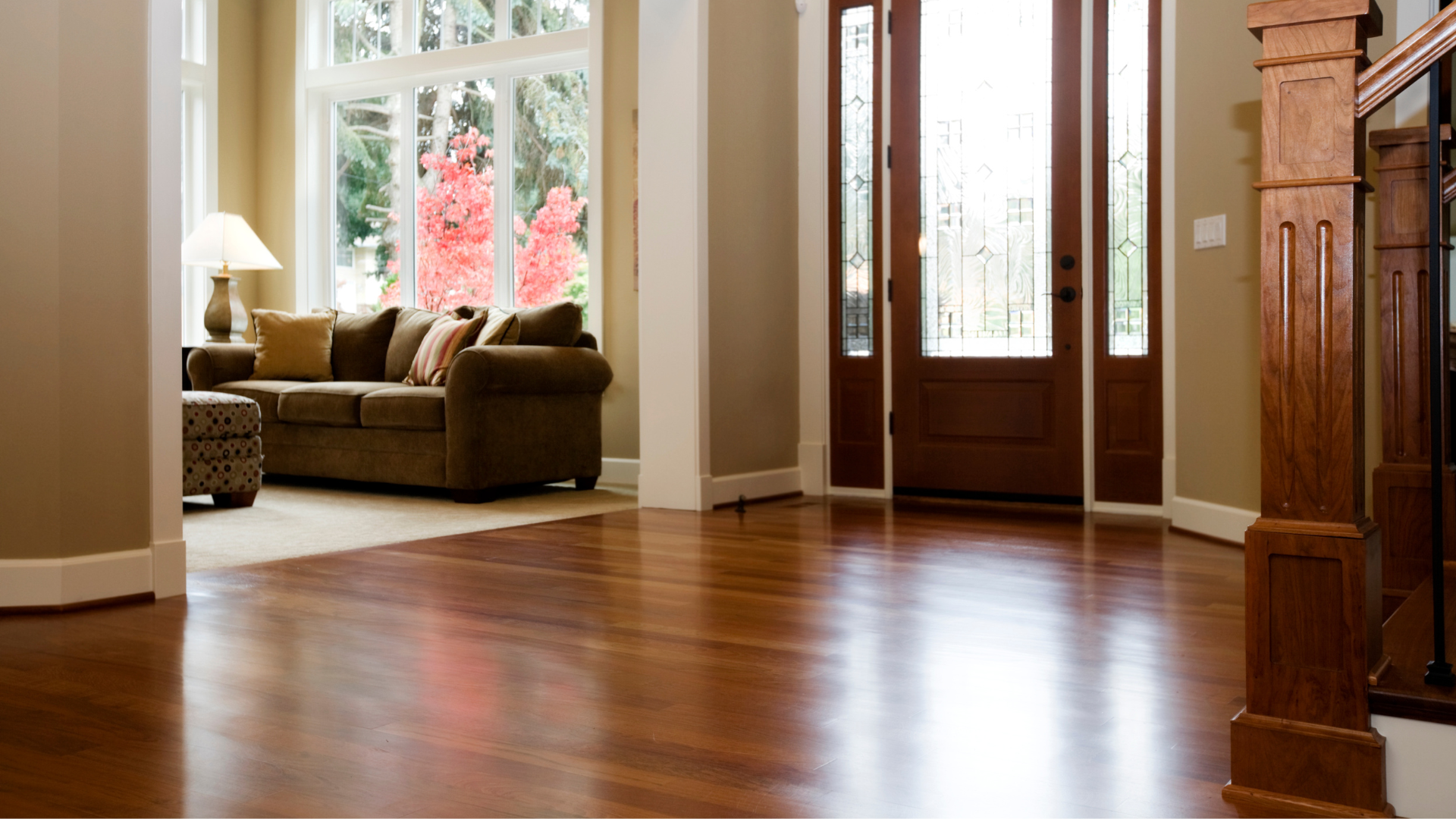 A living room with hardwood floors and a couch