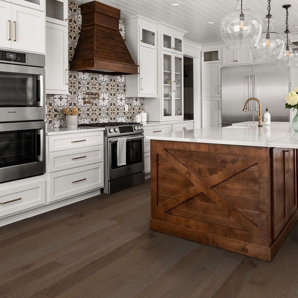 A kitchen with white cabinets , stainless steel appliances , and a large wooden island. Abilene, TX