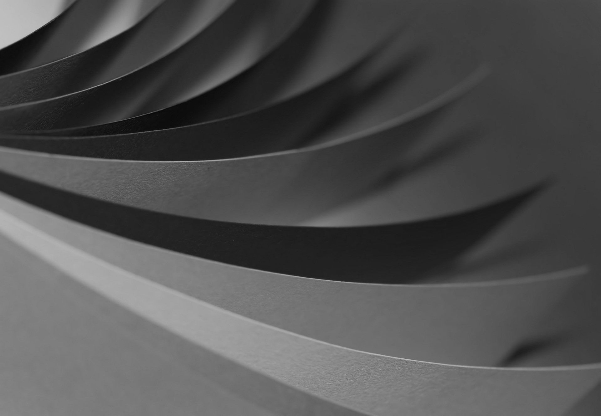 A black and white photo of a swirl of paper