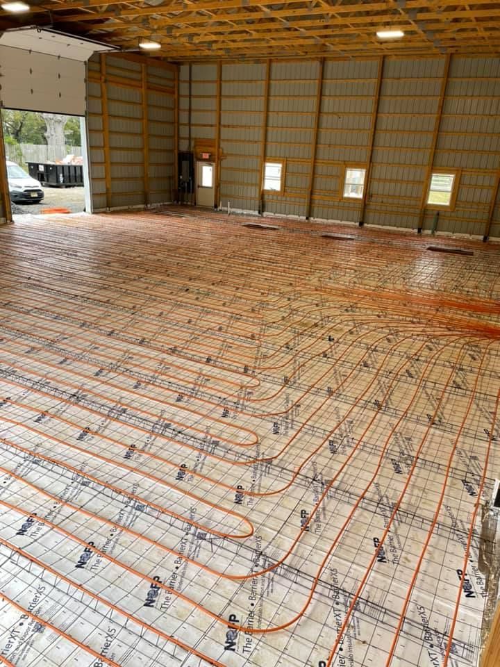 A large building with a lot of pipes on the floor.