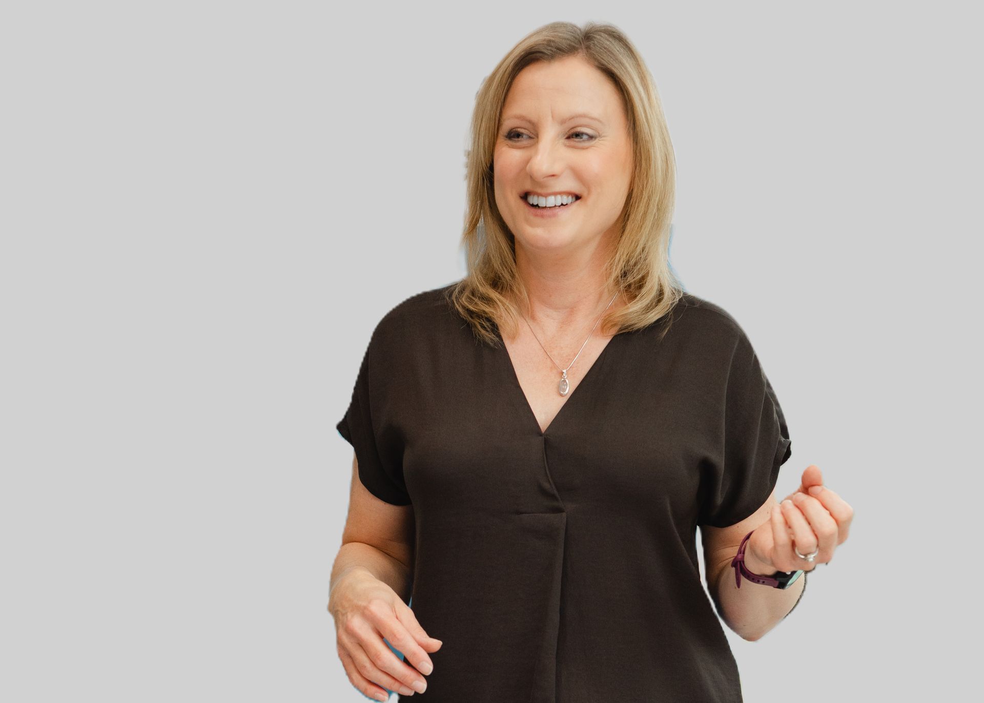 Lady writing on a white board whilst second person is watching.