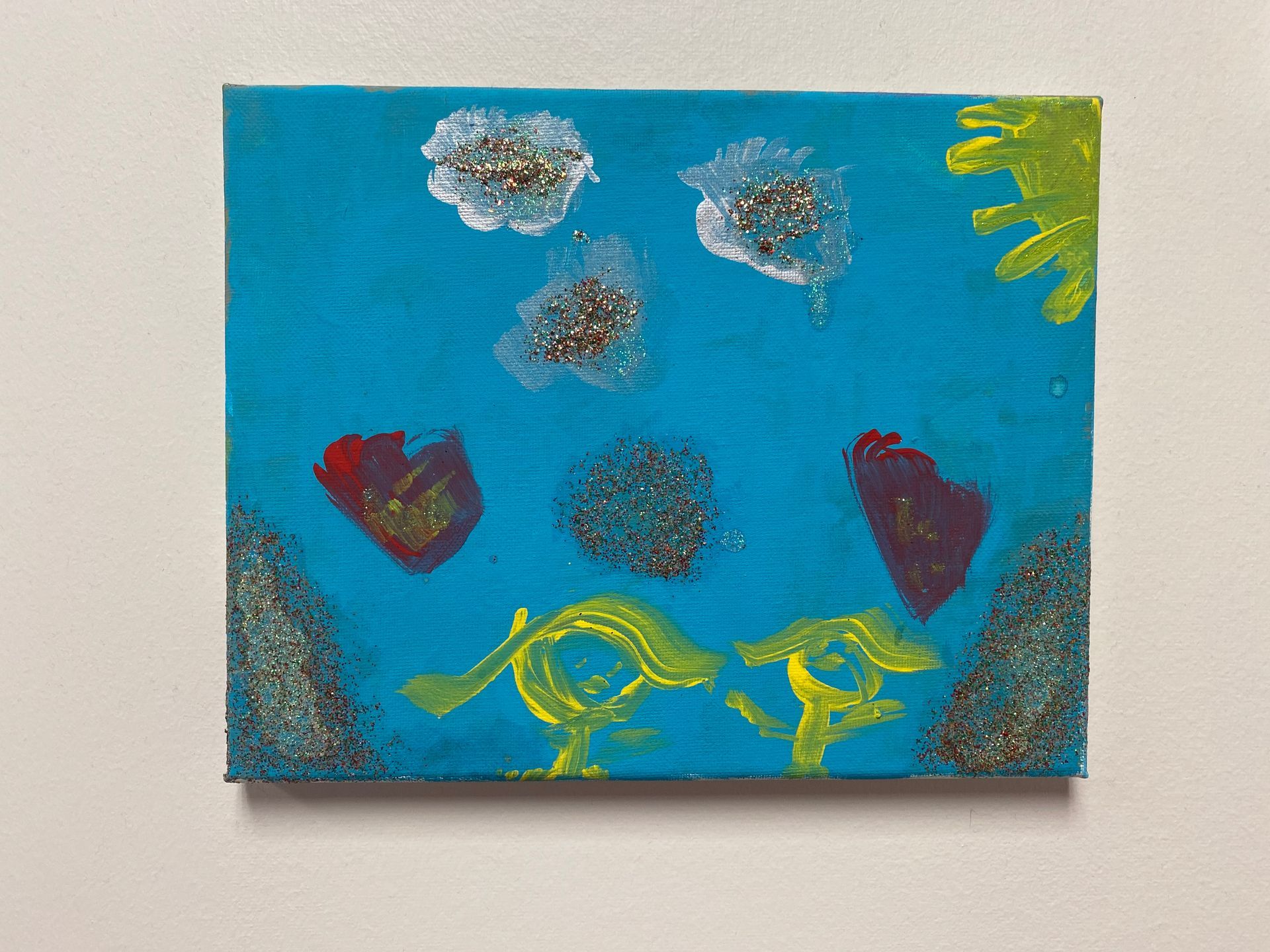 A painting of flowers on a blue background at Dundalk Pediatric Associates