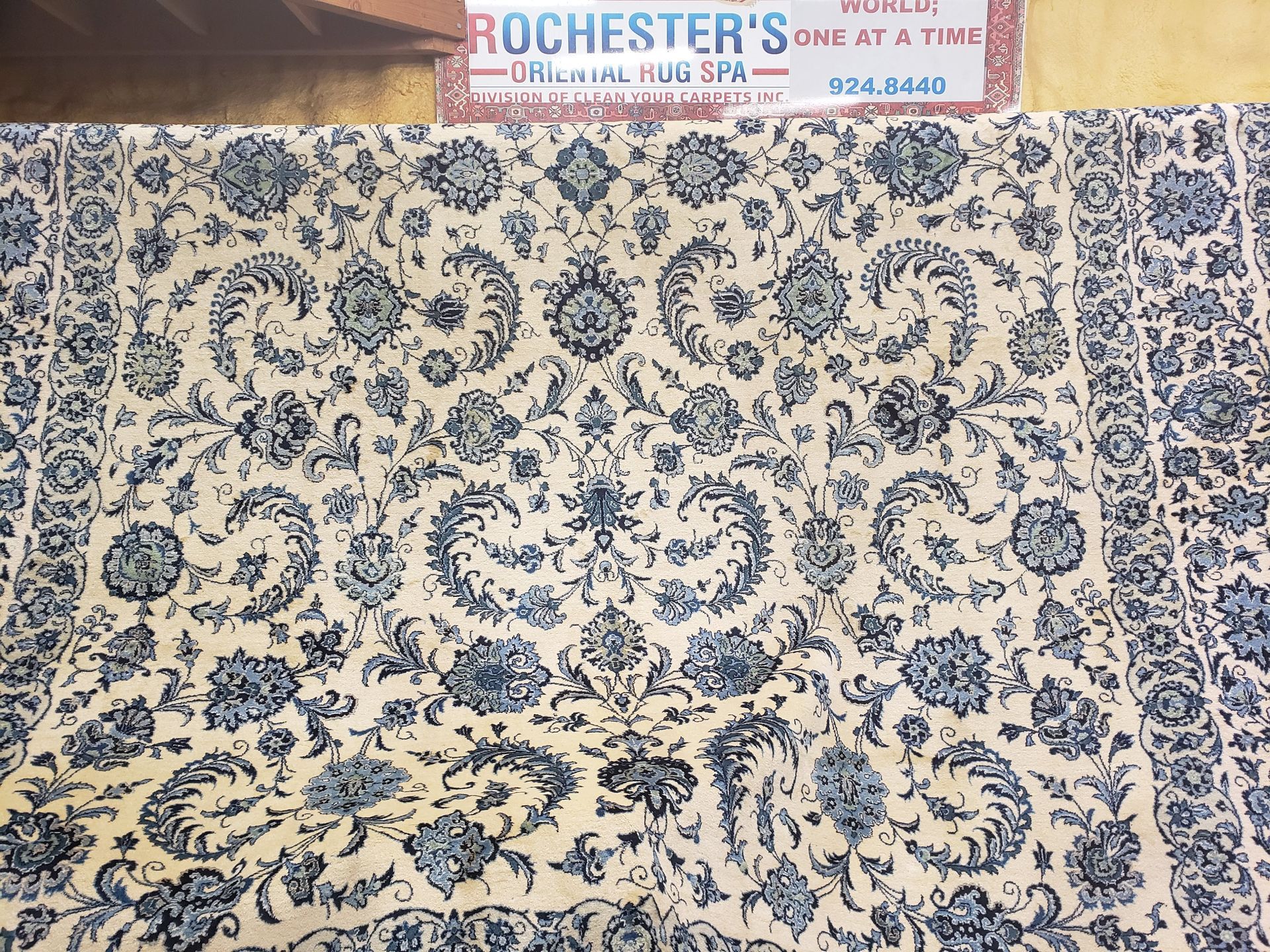 Blue and cream floral patterned rug.
