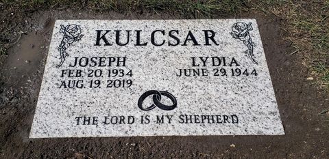 A gravestone with the words `` the lord is my shepherd '' written on it.