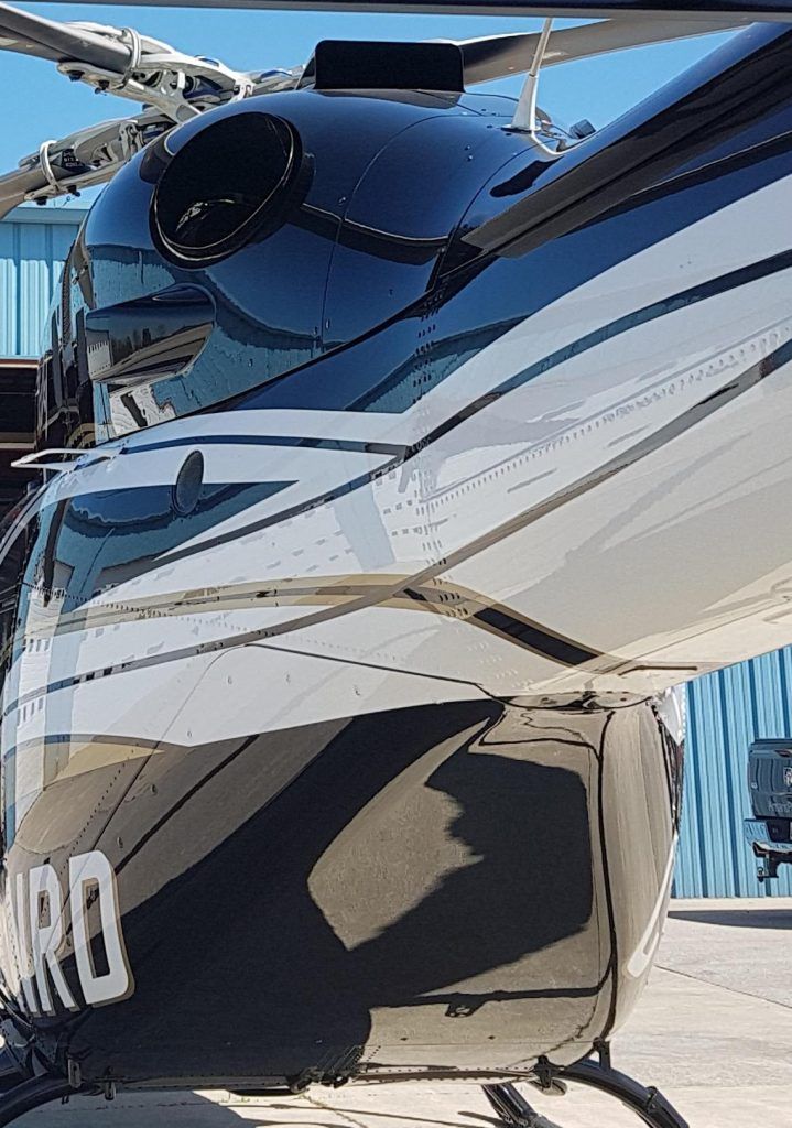 Black and white helicopter tail with the word