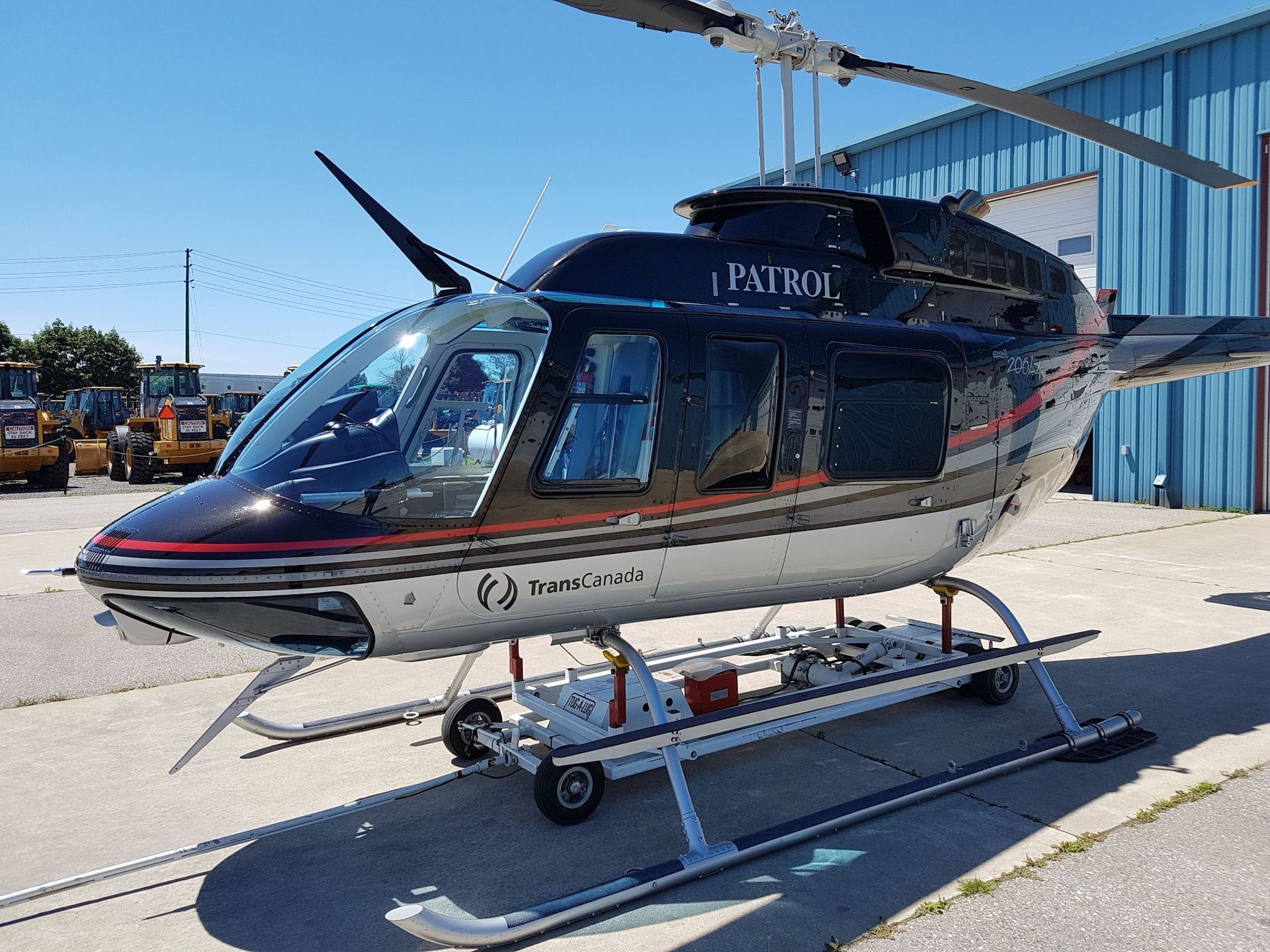 Black and silver helicopter with the word