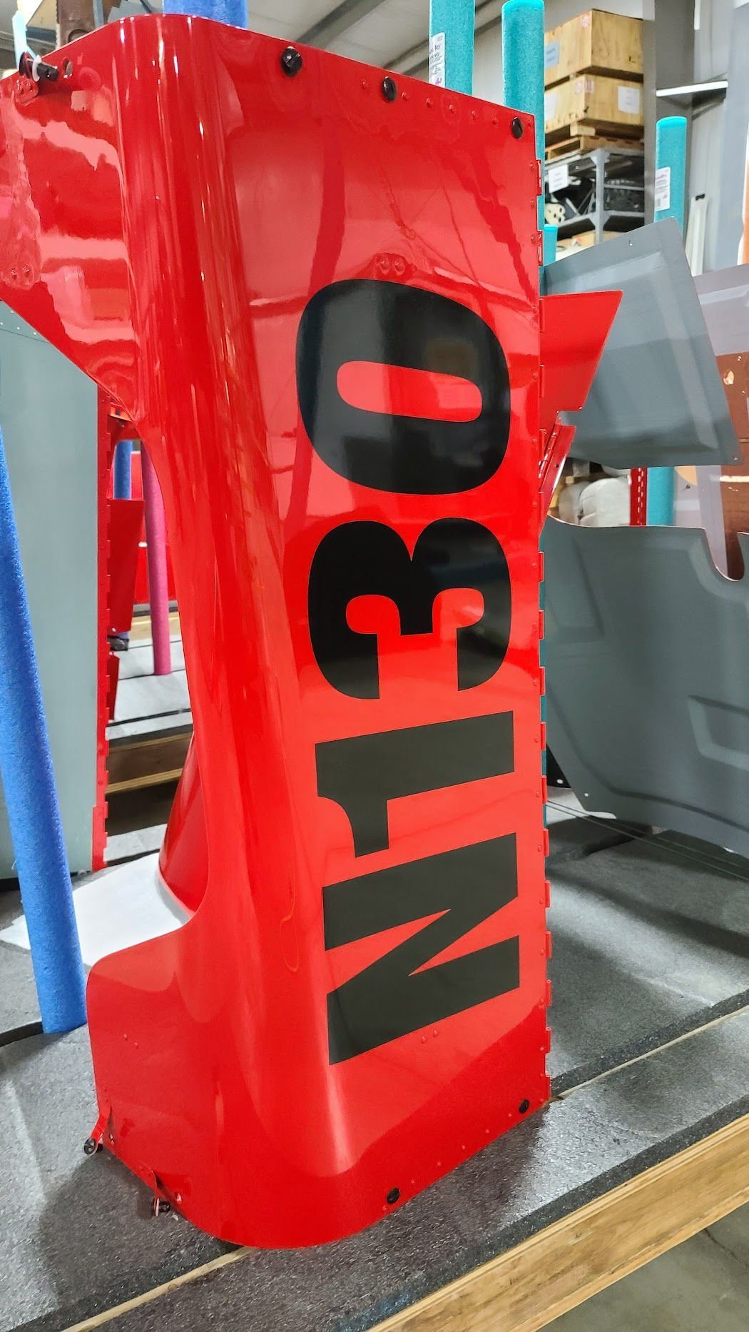 Red vehicle fender with large black