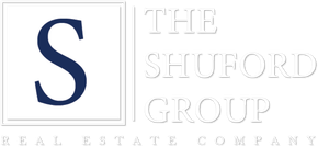 Logo for The Shuford Group Real Estate Company with a large blue “S” and white text