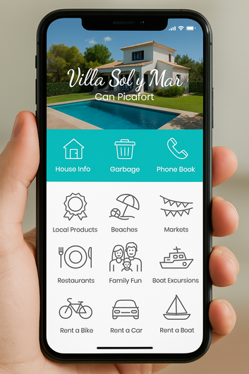 Mano sosteniendo un teléfono que muestra una aplicación móvil para Villa Sol y Mar. La aplicación presenta íconos para información de la casa, basura, directorio telefónico, delicias locales, playas, fiestas, restaurantes, actividades, cruceros, alquiler de bicicletas, alquiler de automóviles y alquiler de barcos.