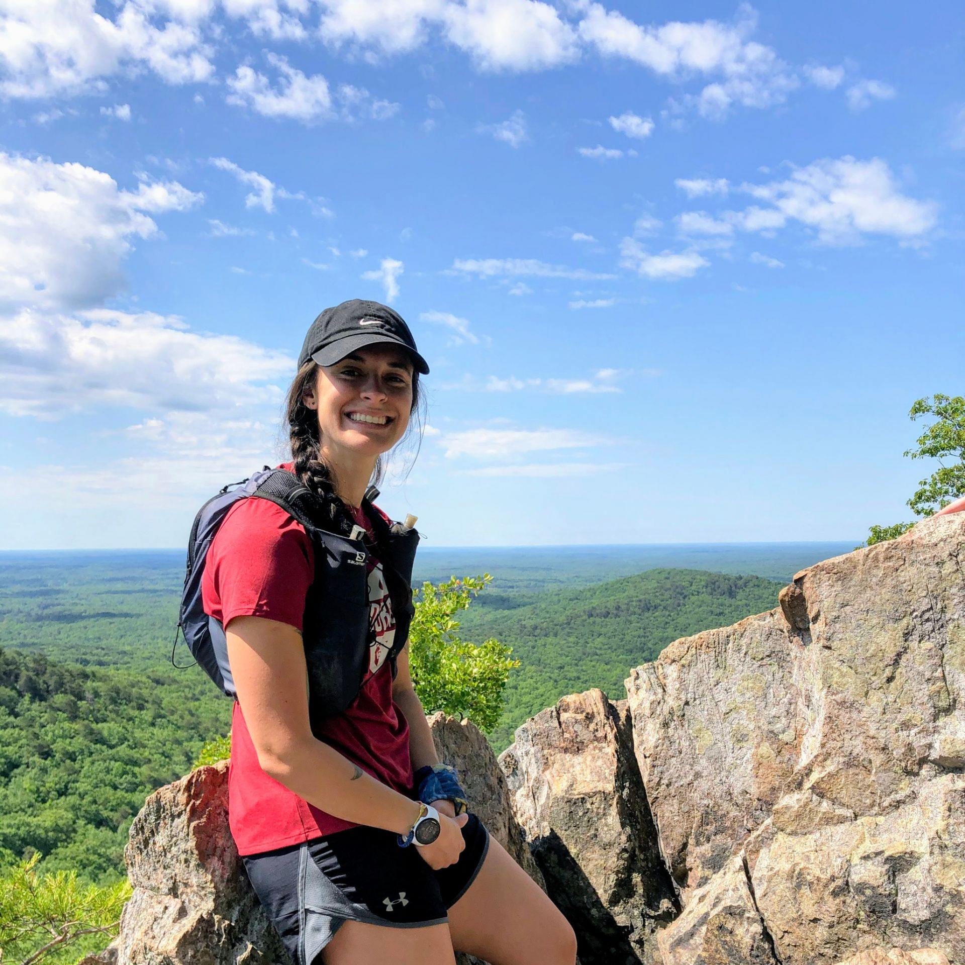 Photo of Megan Biegler smiling on top of a NC mountain 