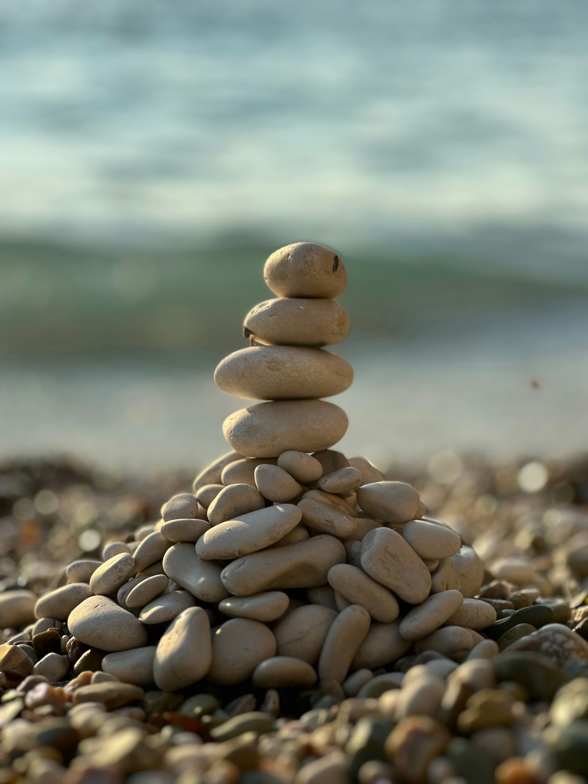 Balancing rock tower photo on beach
