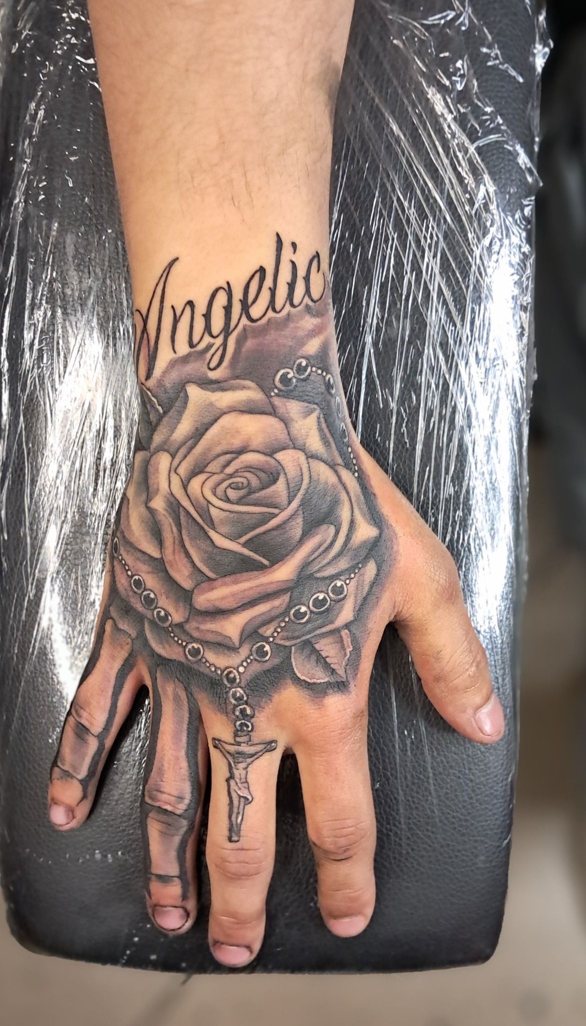 Hand tattoo with the name 