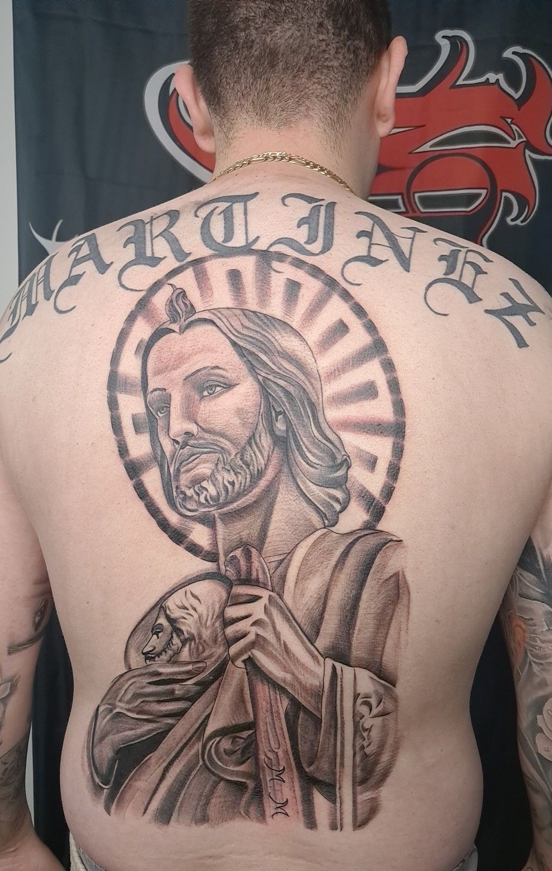 Tattoo of Jesus on a man's back, with 