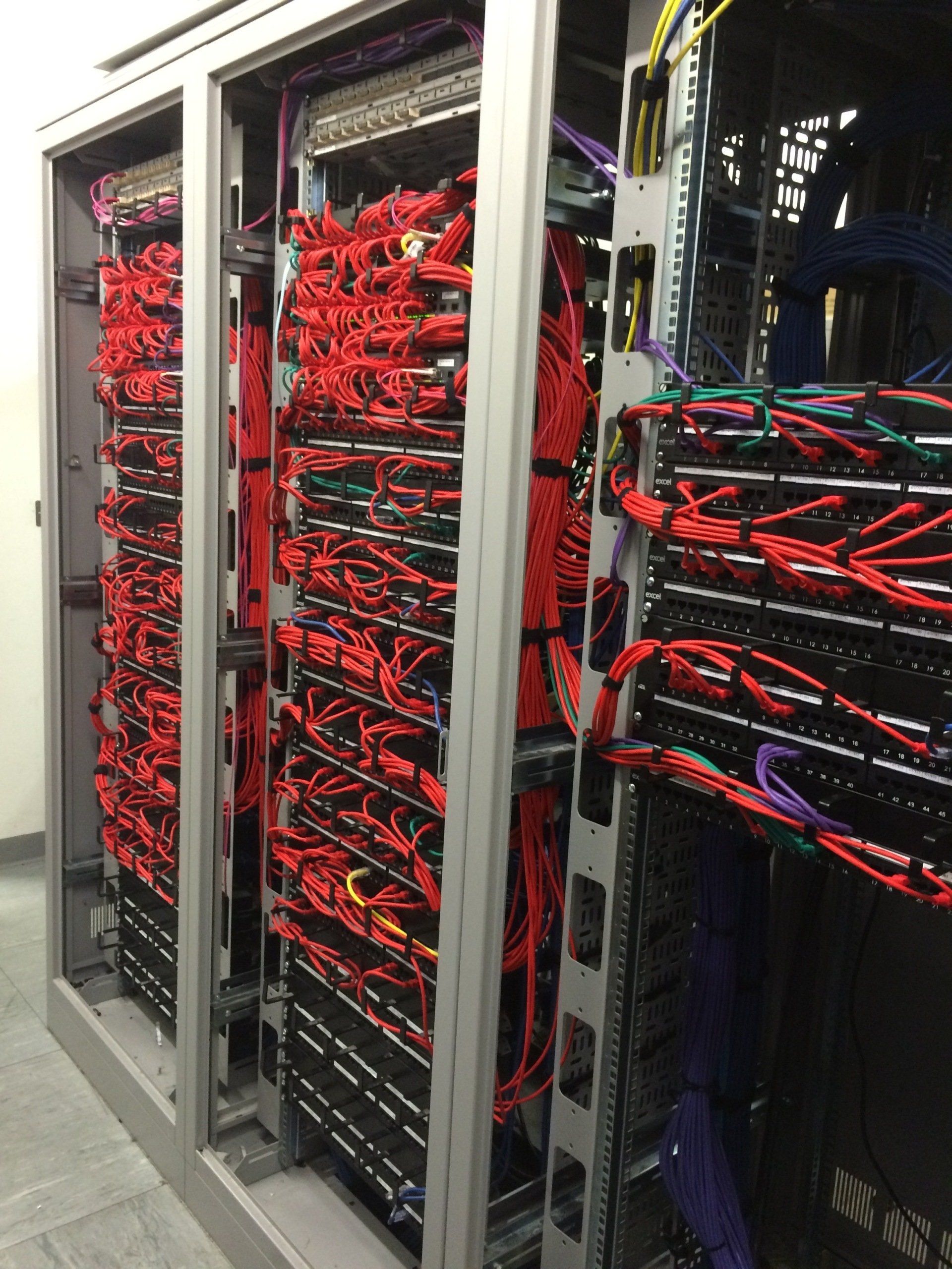 server cabinet with red cables