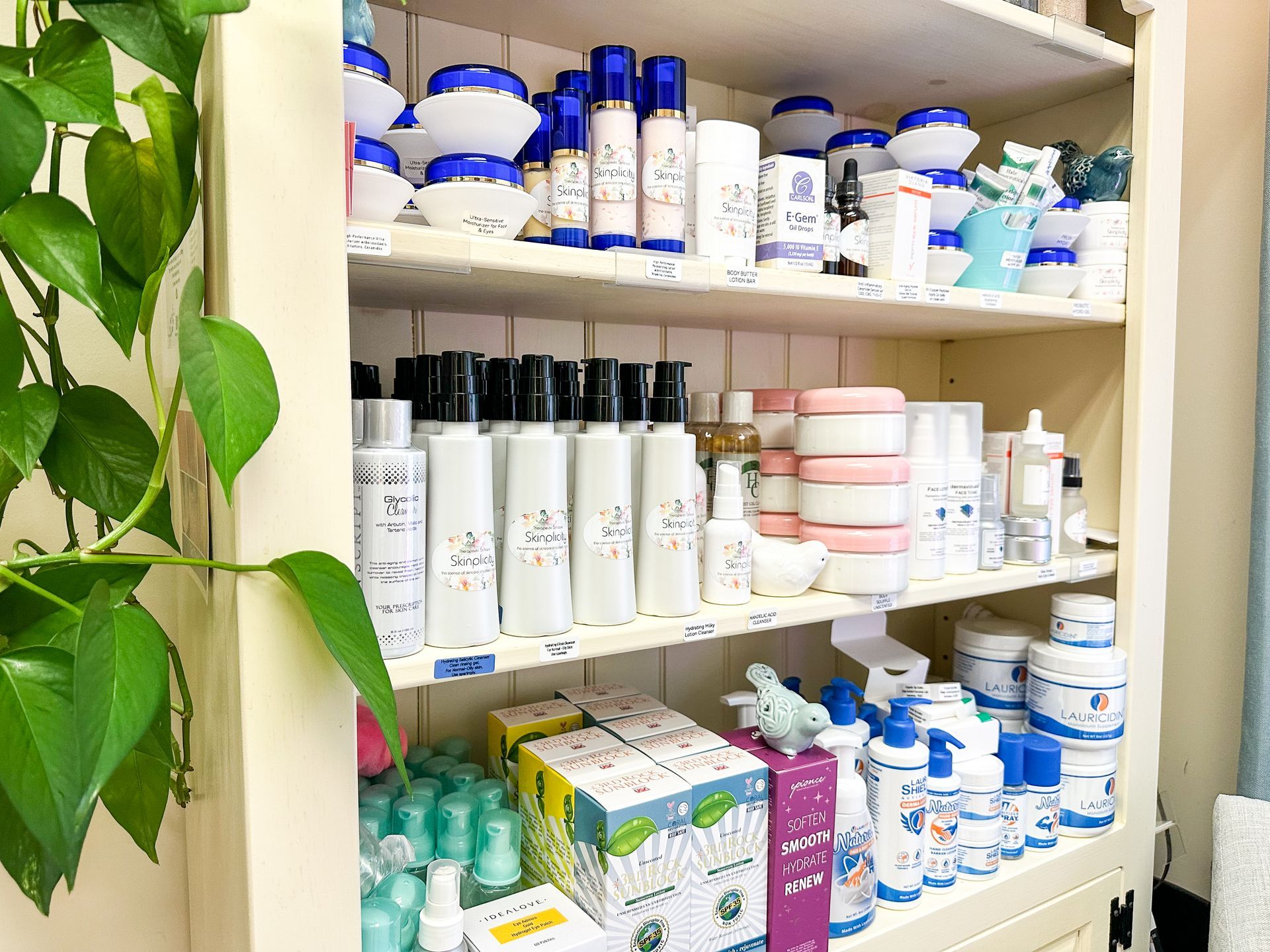 A shelf filled with lots of different types of cosmetics.