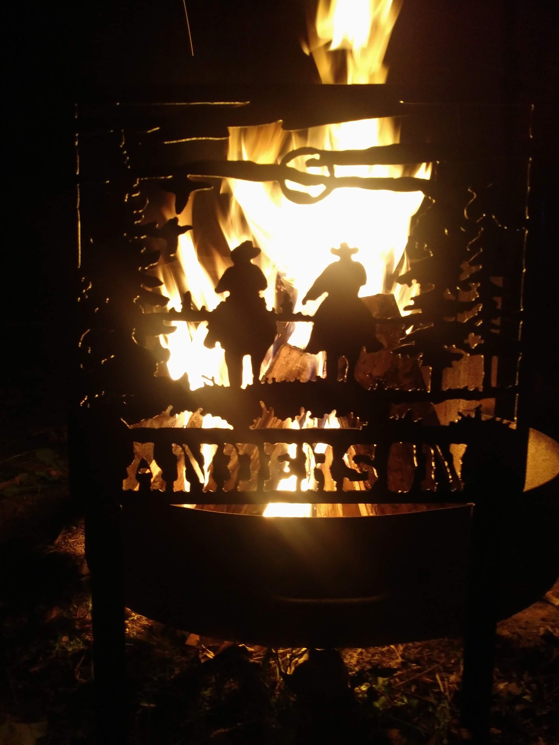 A fire pit with the name anderson on it.